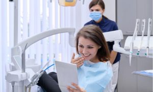 The patient asks the dentist about the best dental implants before getting one.