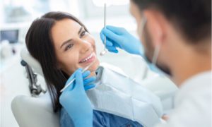 The patient asks her dental implant specialist about the procedure.